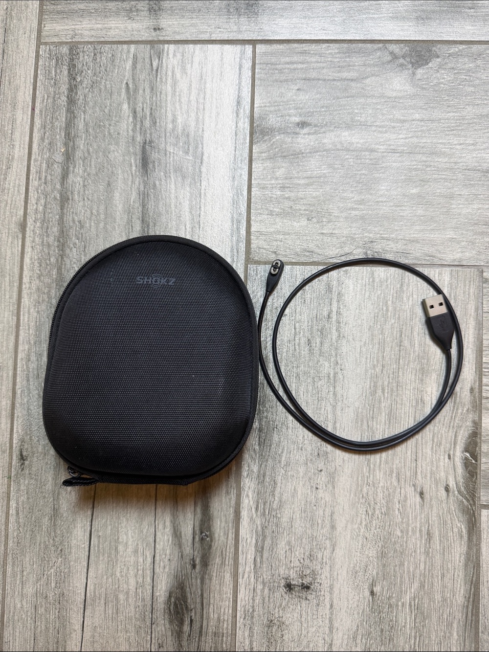 Black Shokz Carrying Case with USB Charging Cable